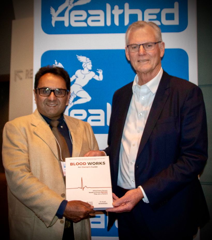 Dr Ramesh Manocha and Professor Shannon Farmer holding Blood Works at HealthEd&rsquo;s Women&rsquo;s & Children&rsquo;s Health conference
